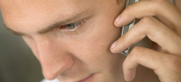 Young man with a telephone